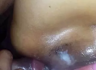 The wife uses a vibrator for anal play with her husband