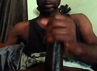 Darkness strokes massive black cock