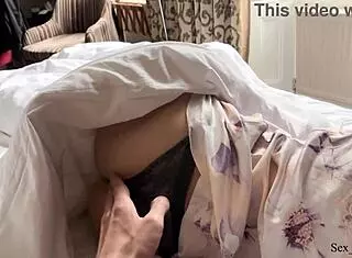 stepmother and son sharing a hotel bed together