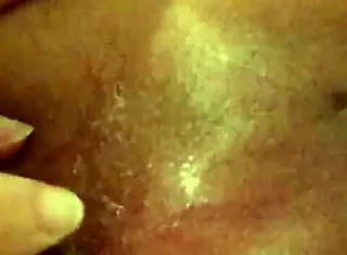 She enjoys butt plug insertion in her tight ass for anal pleasure.