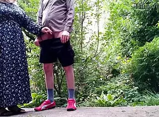 brunette cougar with big tits takes two cocks