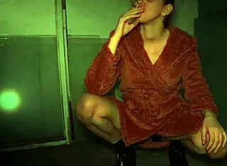 Watch her smoke and spit in high heels while dressed up! It's a fetish homemade video with voyeur elements.