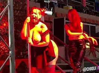 spanish fat woman on stage receives wax treatment