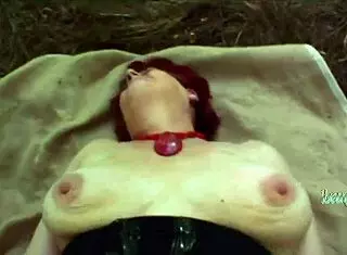 The crazy red-haired granny feels alive in outdoor passion