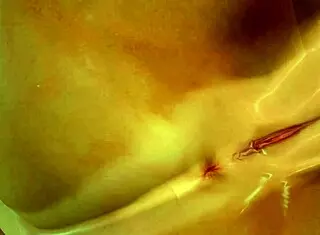 Tanned Patty spreads her shaved pussy on the beach in close up