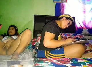 Hey, I’m stroking my huge coño while my stepsister does university homework!