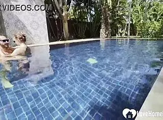 Hot babe swims and teases poolside with couple.