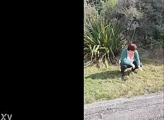 trashy kiwi milf pisses on the roadside with oncoming traffic, showing off her submissive slut side with tattoos and piercings