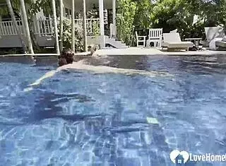 Hot babe swims and teases poolside with couple.