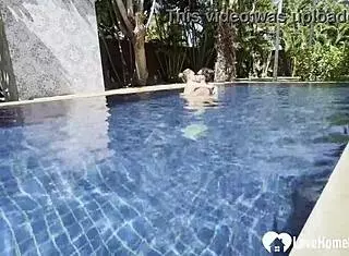 Hot babe swims and teases poolside with couple.