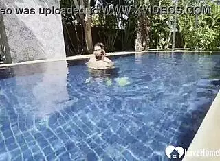 Hot babe swims and teases poolside with couple.