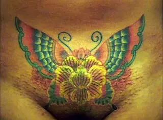 crystal butterfly's tattoo shines under the music's spell