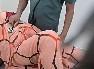 indian doctor asks, how are you feeling today, lady patient?