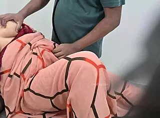 indian doctor asks, how are you feeling today, lady patient?