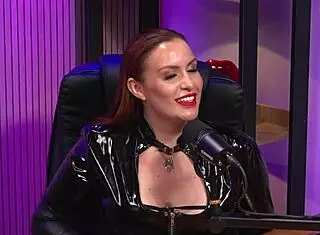 Is the redhead milf queen domme licking pussy in bdsm party?