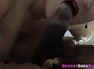 Busty granny throats big black dick