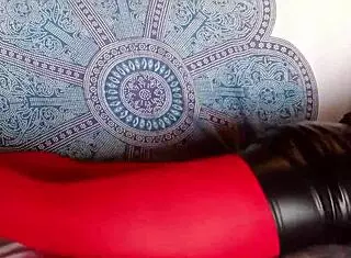 the milf in red pantyhose and black heels showing off beautiful legs