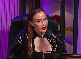 Is the redhead milf queen domme licking pussy in bdsm party?