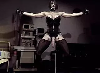 corrupted shemale ashley graham flexes muscles in latex corset suggestively