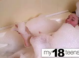 Babe feels intense pleasure masturbating in bath to orgasm closeup.