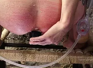 Syringed on Her Knees with Intense Anal Enema Stretching
