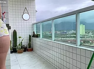 Latina neighbor cleans in shorts for voyeur watching