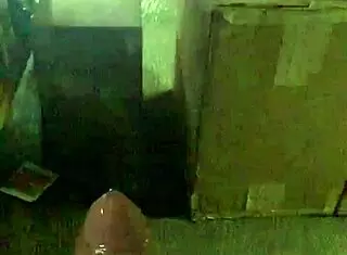 a mexican guy jacking off at his work desk, trying to stay hidden