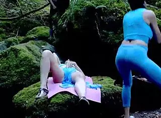 Wild threesome unfolds in forest with sneaky voyeur watching.