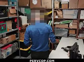 Shoplifting teen bent over by LP officer in garage.