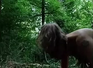 European milf slave humiliated in forest with dildo and handcuffs