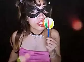 young cute teen bonneyuwu sucks on a lollipop.