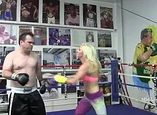 A blonde bombshell engages in mixed boxing