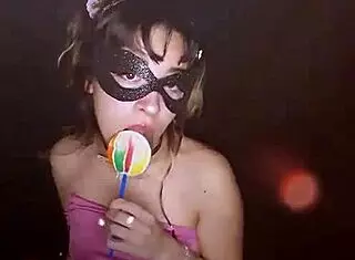 young cute teen bonneyuwu sucks on a lollipop.