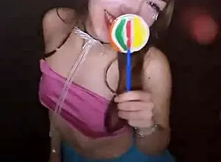 young cute teen bonneyuwu sucks on a lollipop.