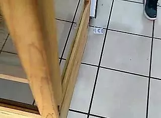 The big ass woman is in the store, looking around.