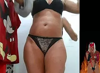 Blonde milf tries on lingerie in changing room