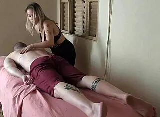 MILF offers massage with her big tits and monster cock.