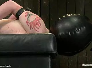 Chained blindfolded slave gets vibrated with dildo roughly.