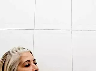 Milf Shoves Dildo in Pussy in Bathroom 😈