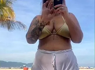 Oh no, these shorts are showing my big pussy at the beach!