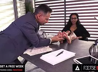 Romy Indy makes her co-worker cum with pretty feet.
