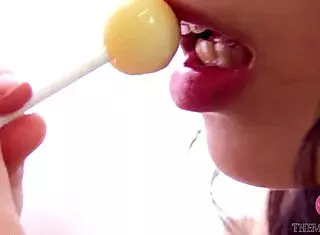 Beauty Licks Candy Nastily In Kitchen!