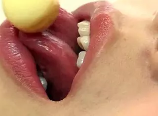 Beauty Licks Candy Nastily In Kitchen!