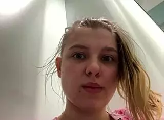 Young teen masturbates with dildo in locker room