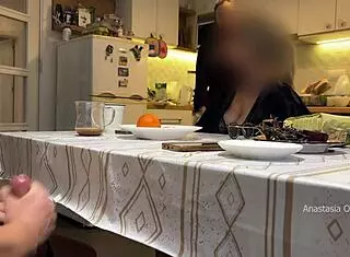 Husband jerks under kitchen table in front of milf stepmom