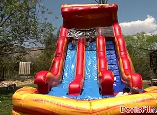 Lesbian beauties toy shaved pussies outdoors with piercing