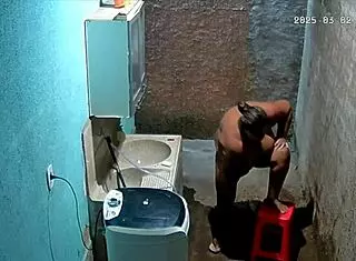 The stepmom shaves her pussy while the stepson secretly watches from the camera.