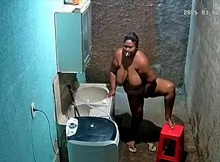 The stepmom shaves her pussy while the stepson secretly watches from the camera.