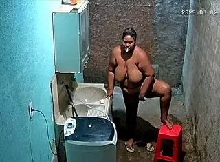 The stepmom shaves her pussy while the stepson secretly watches from the camera.