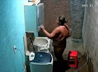 The stepmom shaves her pussy while the stepson secretly watches from the camera.